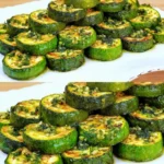 Gebratene Zucchini Ringe mit Kräutern und Knoblauchöl 4 Gebratene Zucchini Ringe mit Kräutern und Knoblauchöl auf einem Teller