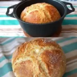 Hausbrot 2 Frisch gebackenes Hausbrot auf einem Holzbrett
