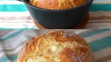 Frisch gebackenes Hausbrot auf einem Holzbrett