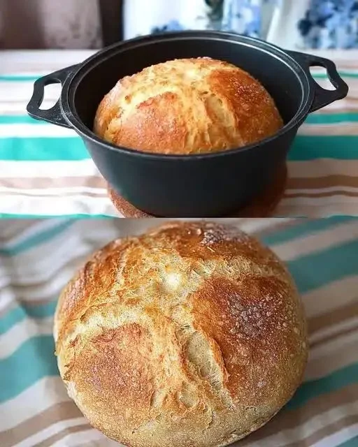 Hausbrot 7 Frisch gebackenes Hausbrot auf einem Holzbrett