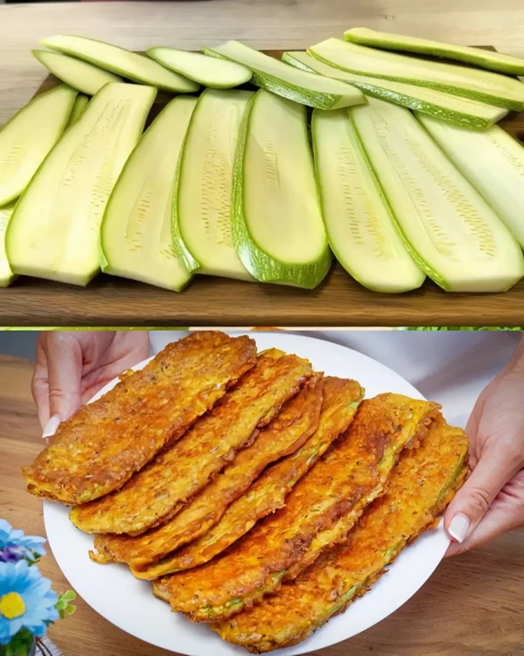 Panierte Zucchini-Scheiben mit Parmesan für jeden Tag 9 Panierte Zucchini-Scheiben mit Parmesan auf einem Teller angerichtet