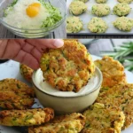 Schnelle Zucchini-Bratlinge mit Käse und Knoblauch 3 Schnelle Zucchini-Bratlinge mit Käse und Knoblauch auf einem Teller serviert