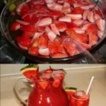 Sommerliche Erdbeer-Bowle mit Melone 4 Sommerliche Erdbeer-Bowle mit frischen Erdbeeren und Melone serviert in einer Glaskaraffe
