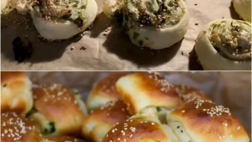 Köstliche Bärlauch-Schnecken mit Käse auf einem Teller, garniert mit frischen Kräutern.