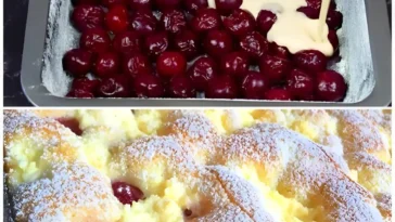 Saftiger Quark Kirschkuchen auf einem Teller, dekoriert mit Kirschen.