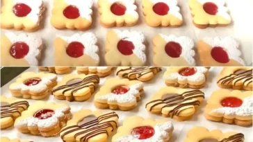 Delikate Spitzbuben Plätzchen aus Lebkuchenteig verziert mit Puderzucker